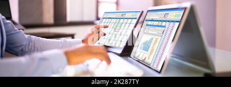 African American Analyst Using Spreadsheet Stock Photo