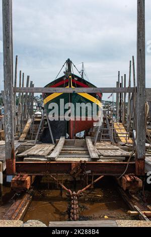 The Isabella a vintage wooden ship in drydock in Gloucester Harbor, Massachusetts. Stock Photo