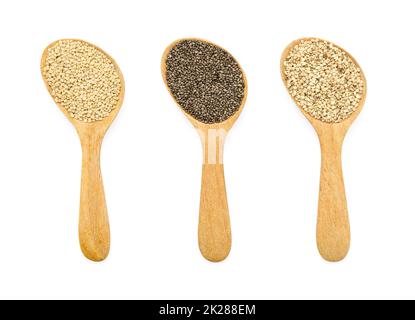 Organic dry healthy seeds consisted of chia, quinoa and sesame in wooden spoon on white background. Stock Photo