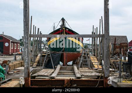 The Isabella a vintage wooden ship in drydock in Gloucester Harbor, Massachusetts. Stock Photo