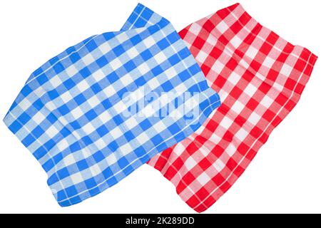 Closeup of a red and a blue white checkered napkin or tablecloth texture isolated on a white background. Kitchen accessories. Top view. Stock Photo