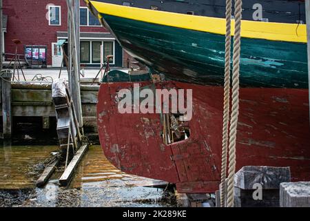 The Isabella a vintage wooden ship in drydock in Gloucester Harbor, Massachusetts. Stock Photo