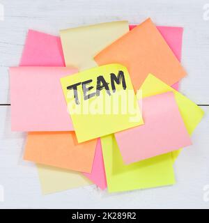 Team teamwork working together business concept desk note paper Stock Photo