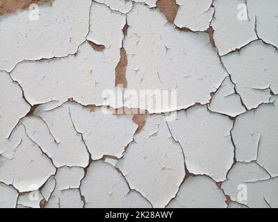 Background texture wall with peeling paint. Peeling old paint wall. Stock Photo
