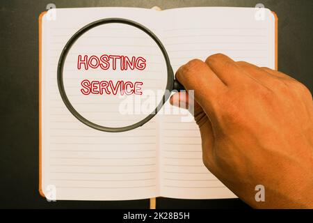 Inspiration showing sign Hosting Service. Business idea provides services for the website to be seen in the Internet Office Supplies Over Desk With Keyboard And Glasses And Coffee Cup For Working Stock Photo