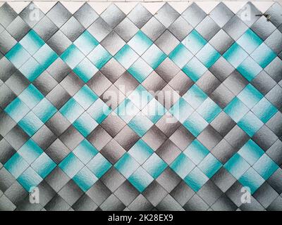 Old tile on the wall. The background texture of tile is blue and grey. Stock Photo
