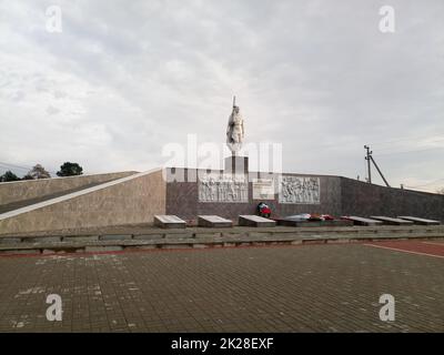 War memorial at the site of the mass grave. Monument to soldiers who died in World War II. Stock Photo