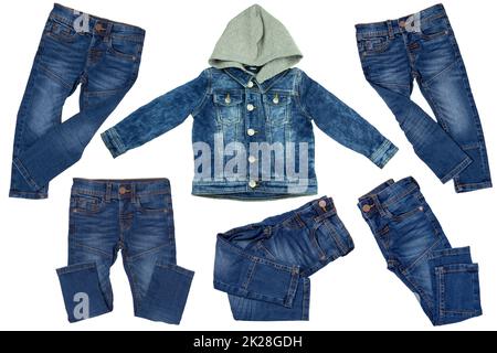 Collection jeans clothes on white background. Set of a denim jacket with detachable hood for child boy and various trendy stylish blue denim stretch pants or trousers. Jeans summer and autumn fashion. Stock Photo