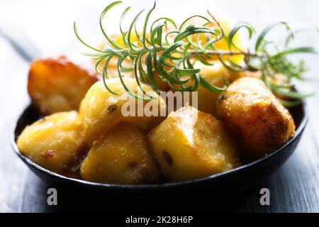 rustic golden english roasted duck fat potatoes Stock Photo