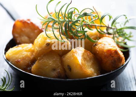 rustic golden english roasted duck fat potatoes Stock Photo