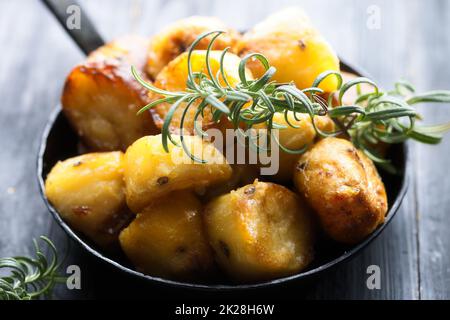 rustic golden english roasted duck fat potatoes Stock Photo