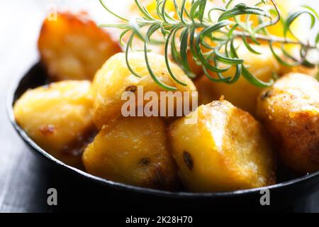 rustic golden english roasted duck fat potatoes Stock Photo