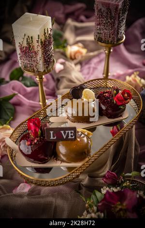 Still life of heart shaped mousse cakes Stock Photo