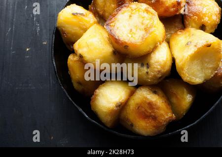 rustic golden english roasted duck fat potatoes Stock Photo