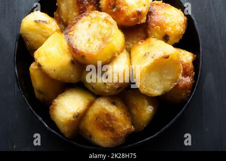 rustic golden english roasted duck fat potatoes Stock Photo