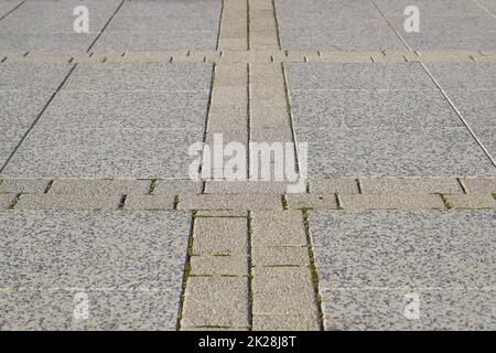 Figure out the paving slabs in the square. Background of paving slabs. Texture of stone products Stock Photo
