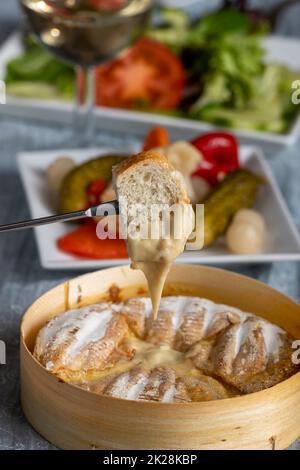 swiss cheese fondue with bread Stock Photo