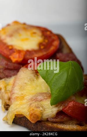 grilled bread with tomatoes and cheese Stock Photo