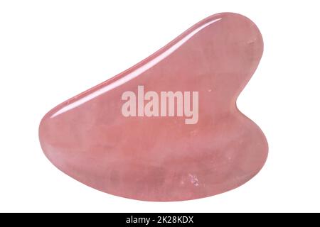 Natural Gua Sha Rose quartz Stone isolated. Guasha Massage Tool alternative therapy to improve circulation. Face stone massage.  Clipping path. Chinese healing method to better health. Stock Photo
