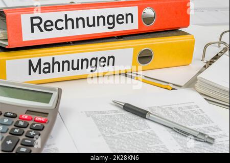 Folders with the label Invoices and Warnings - Rechnungen und Mahnungen (German) Stock Photo