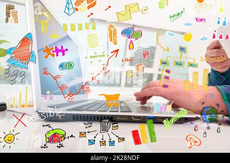 Businessman in office works with laptop on new projects Stock Photo