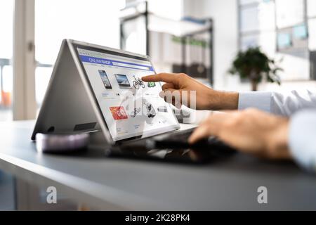 Ecommerce Shopping On Convertible Laptop Stock Photo