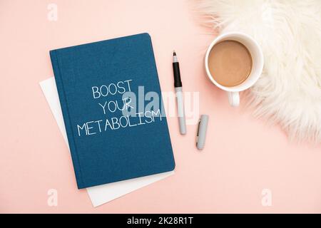 Text showing inspiration Boost Your Metabolism. Business idea Increase the efficiency in burning body fats Office Supplies Over Desk With Keyboard And Glasses And Coffee Cup For Working Stock Photo