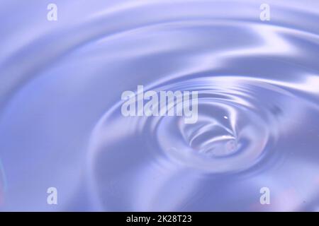 Beautiful blue background in the form of circles on the water. Universal abstract blurred background. Stock Photo