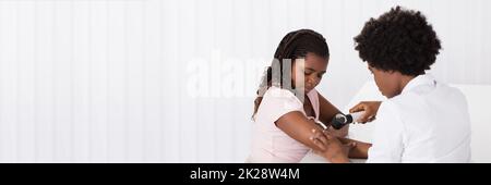 African American Dermatology Consultation. Doctor Checking Child Skin Stock Photo