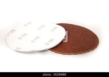 Round discs of sandpaper isolated on white. Stock Photo