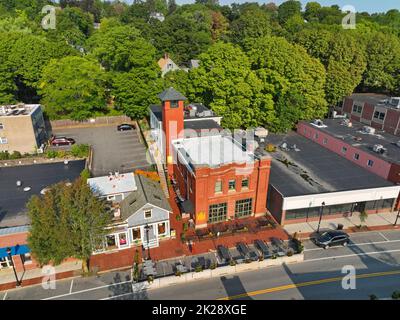 Historic fire station building on Leonard Street in historic center of Belmont, Massachusetts MA, USA. Now this building is a restaurant. Stock Photo