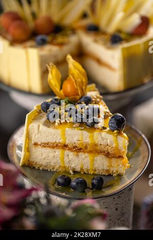 Slice of birthday cake with mascarpone cream Stock Photo