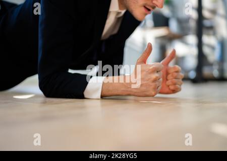 Man Doing Office Plank Exercise Workout Stock Photo