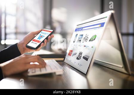 Online Ecommerce Shopping On Convertible Laptop Stock Photo