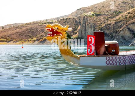 A brightly coloured Dragon Boat on the river Stock Photo