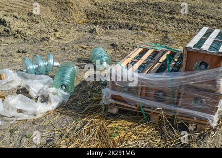 High-voltage insulators of glass insulators. Installation of high-voltage power lines Stock Photo