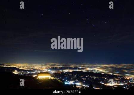 Plain illuminated partially covered by fog, soft lights Stock Photo