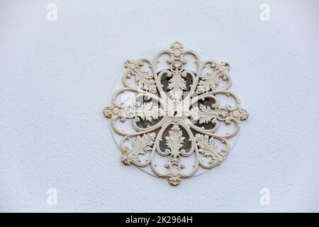 Decorative ornament on a white house facade Stock Photo