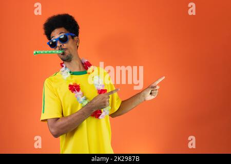Brazilian Player- Black Man Celebrating With Yellow T Shirt Isolated Stock Photo
