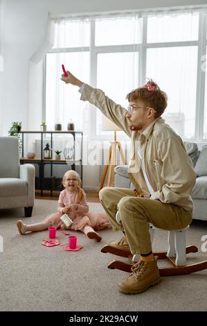 Overjoyed father and daughter spending time together Stock Photo