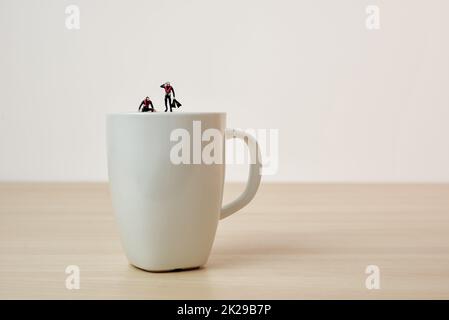 Coffee divers. Conceptual macro photo Stock Photo