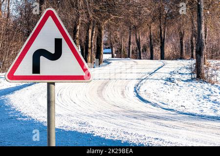 Road sign on a snow-covered road Stock Photo
