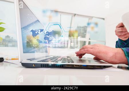 Man works with laptop with internet streaming service Stock Photo