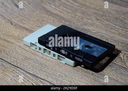 Audio cassette. Retro music medium, compact cassette tape recorder. Stock Photo