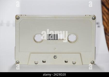 Audio cassette. Retro music medium, compact cassette tape recorder. Stock Photo