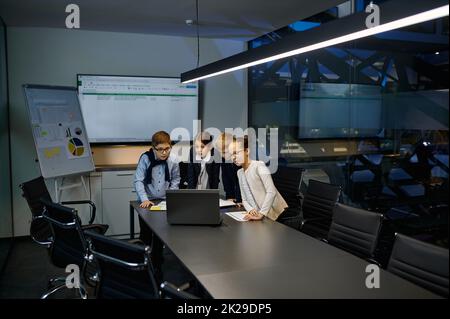 Diverse children business team analyzing financial data Stock Photo
