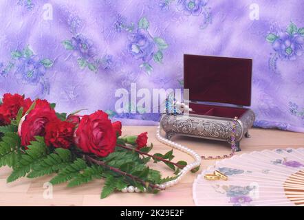 Red Roses with Wedding Bands and Jewelry Box Stock Photo