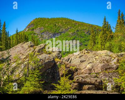 Beautiful mountain panorama Norway Hemsedal Skicenter with snowed in Mountains. Stock Photo