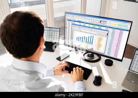 Analyst Working With Spreadsheet Business Data Stock Photo