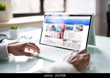 African American Reading Online News Media Stock Photo